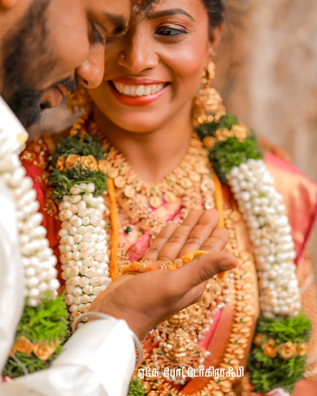 Candid wedding couple sharing emotional glance during ceremony in Coimbatore