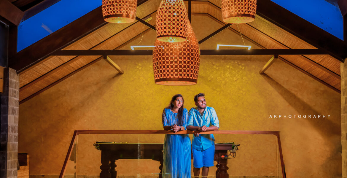 Resorts in Ooty for the Perfect Photoshoot: AK Photography's Ultimate Guide A couple posing in front of a chandelier. Enchanting Pre-Wedding Couple Shoot of Krishna & Nivetha in Ooty,